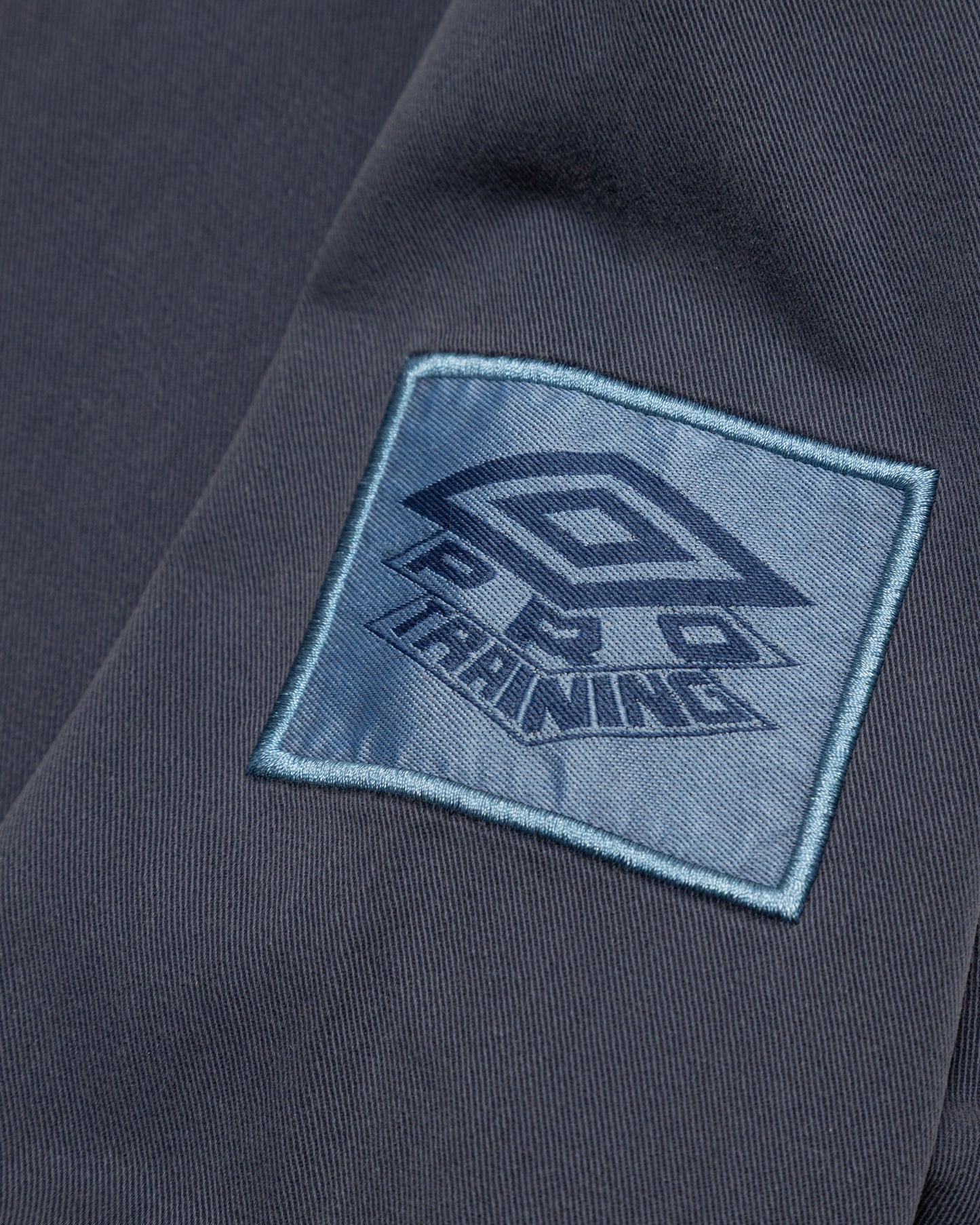 Throwing Fits x Umbro Drill Top